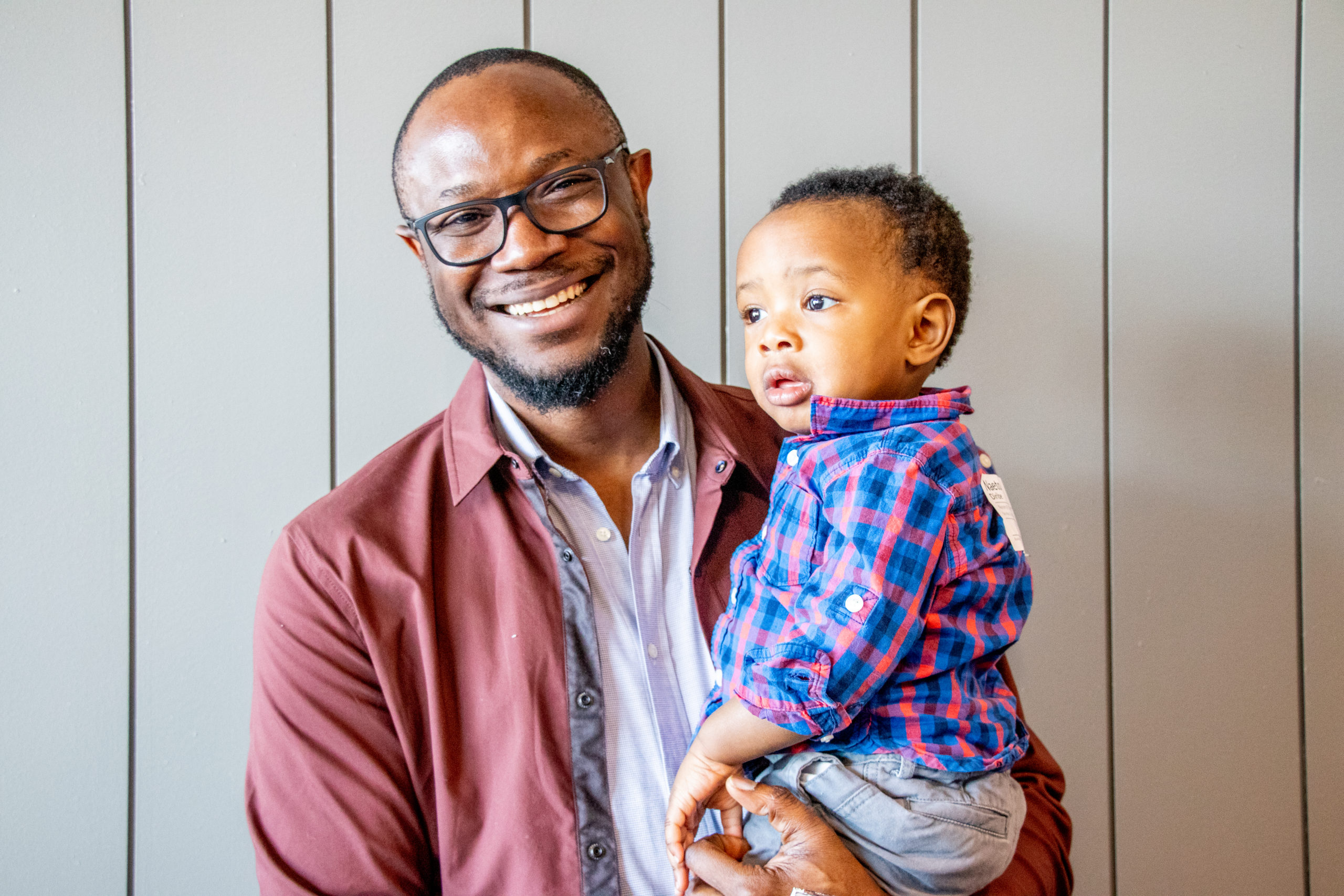 Nigerian man holding his son