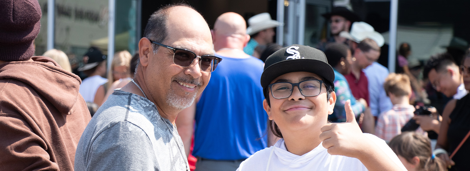 Man and boy looking at the camera and smiling