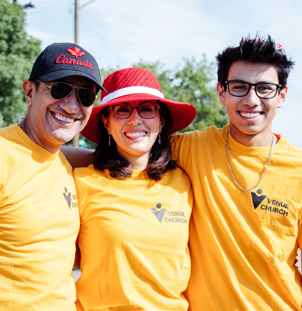 Columbian family with their arms around each other